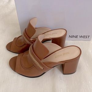 Leather with gold zipper detail son upper, slip on heels